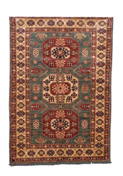 Kazak-style rugs are known for their blues, rosy reds and ivories. This one uses commercially produced natural dyes such as indigo and cochineal. (3’10” x 5’8”: $950)